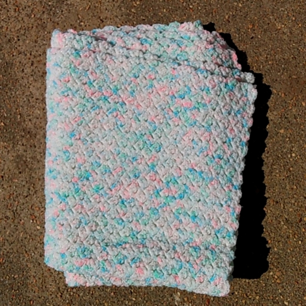 Handed knitted variated color baby afghan. New